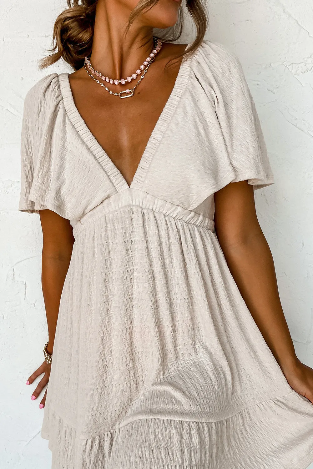 Beige Textured Deep V Neck Cutout Back Mini Dress