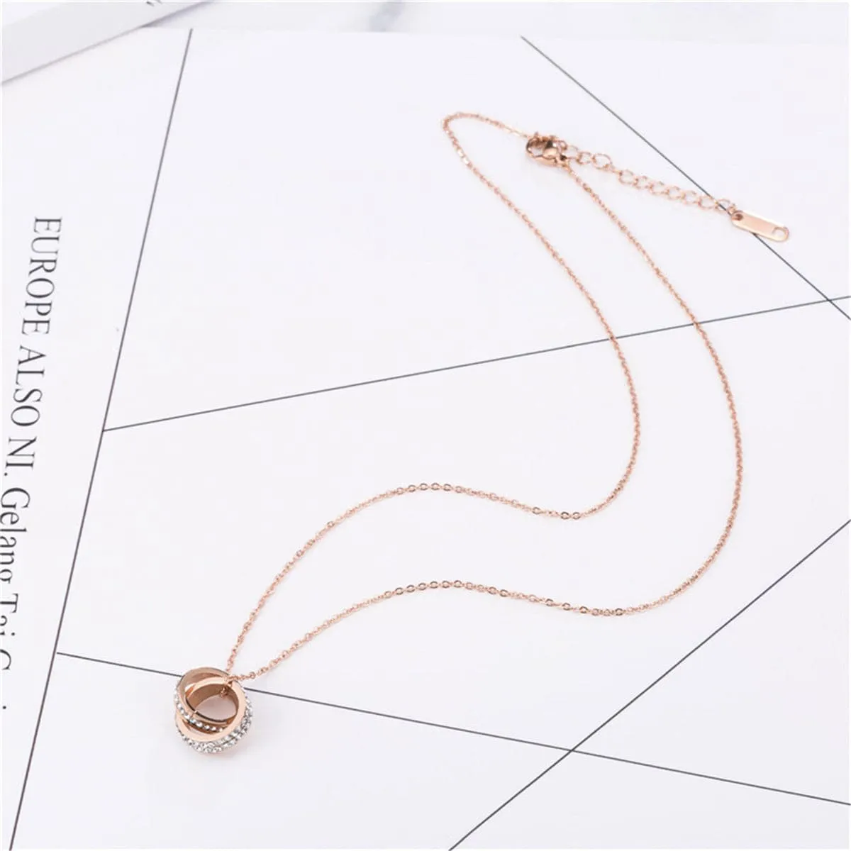 Cubic Zirconia & 18K Rose Gold-Plated Crossed Ring Pendant Necklace