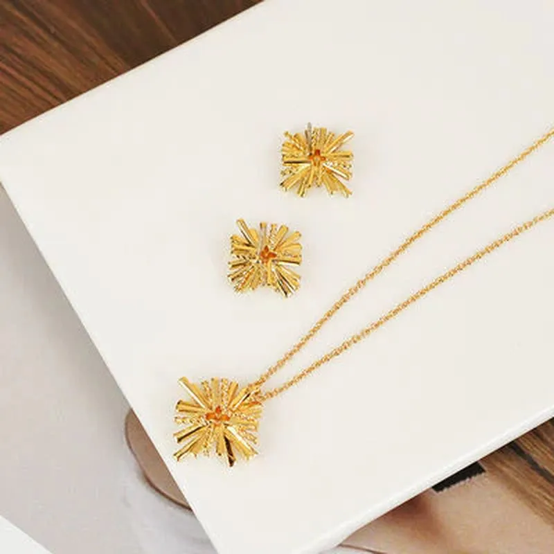 Radiant Starburst Gold-Plated Earrings & Necklace Set - Elevate Your Elegance!
